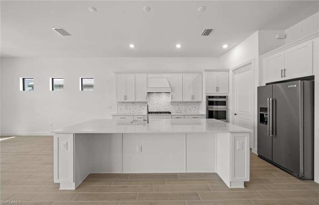 1992 Don Benito Way Naples, FL 34120 - Photo 8 of 49 Built in kitchen with enterainment package