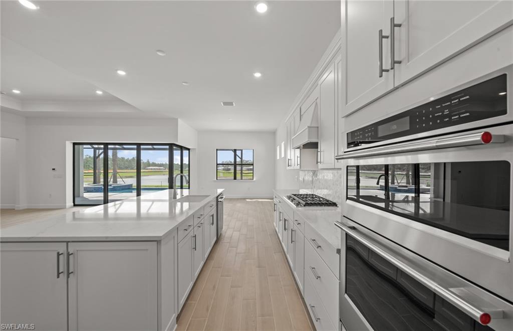 1992 Don Benito Way Naples, FL 34120 - Photo 9 of 49 Built in kitchen with enterainment package