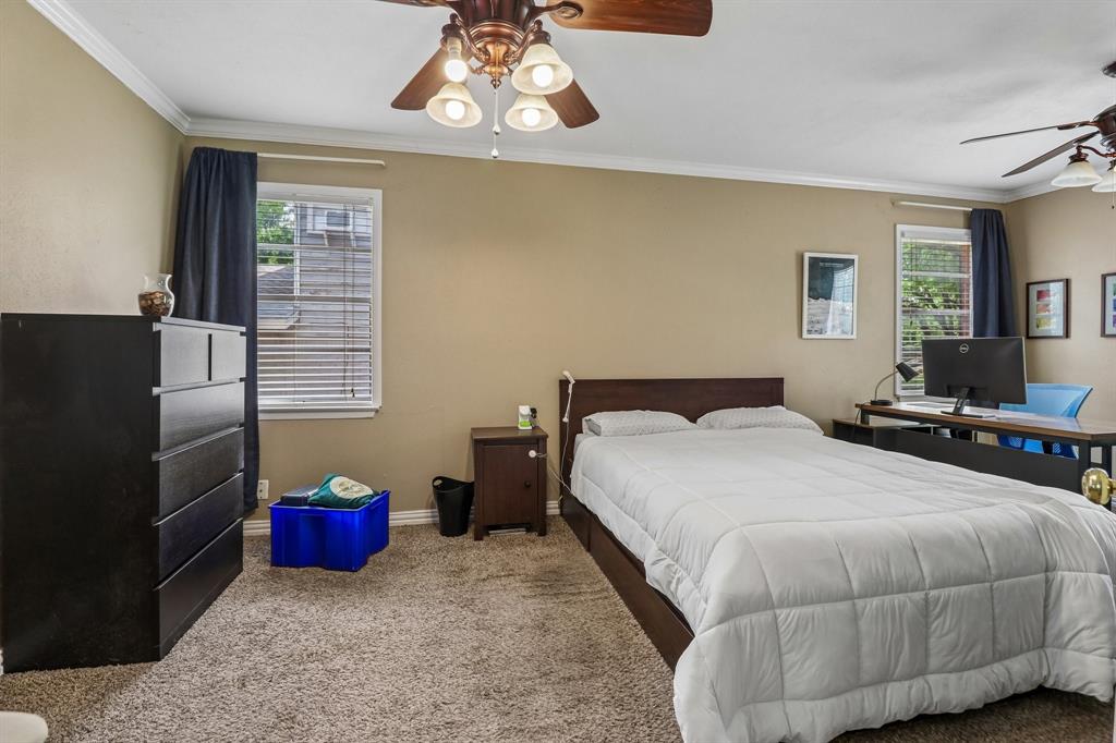 820 North Bowen Road Arlington, TX 76012 - Photo 27 of 40 a bedroom with a bed and wooden floor