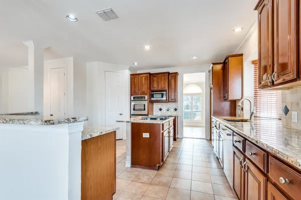 $915,500 | 702 East Peninsula Drive, Coppell, TX 75019