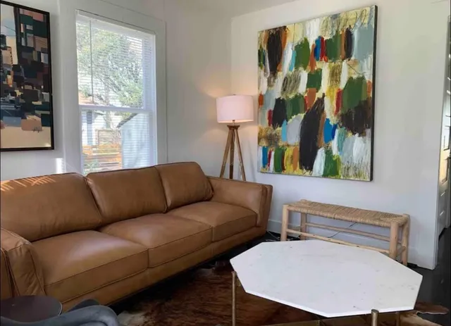 a living room with furniture and a window