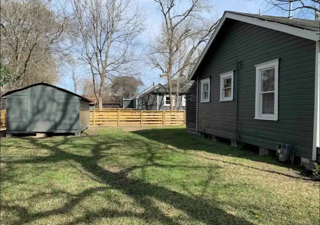 a backyard of a house with lots of green space
