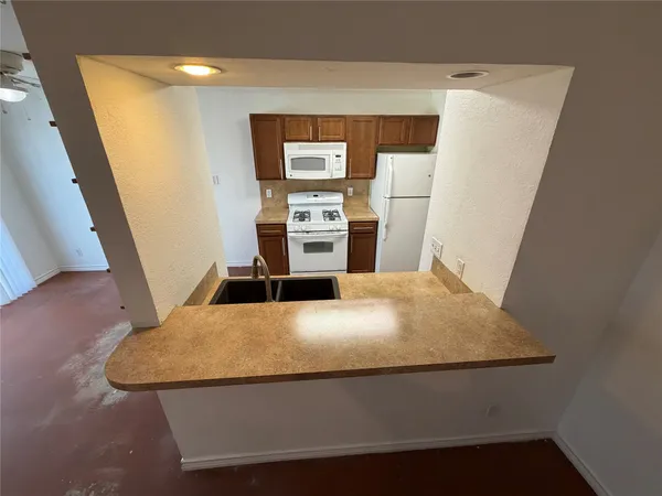 a view of kitchen and wooden floor