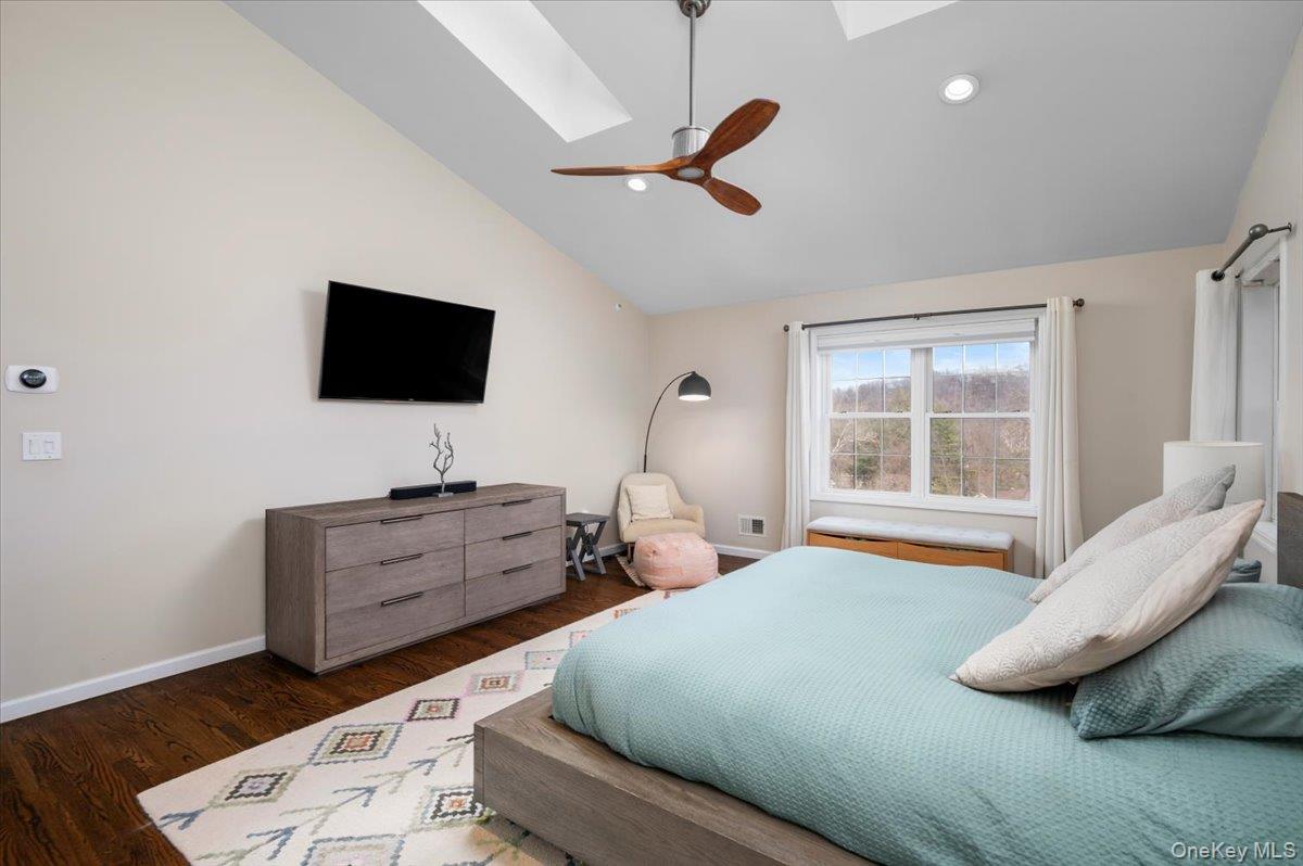 9 Drake Lane White Plains, NY 10607 - Photo 12 of 32 a bedroom with furniture and a flat screen tv