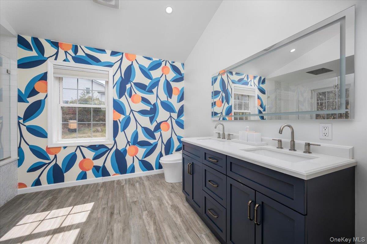 9 Drake Lane White Plains, NY 10607 - Photo 13 of 32 a bathroom with a sink a vanity and a mirror