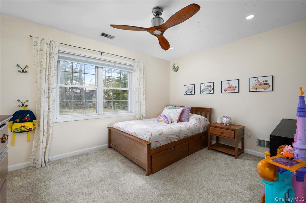 9 Drake Lane White Plains, NY 10607 - Photo 15 of 32 a bedroom with a bed and a window
