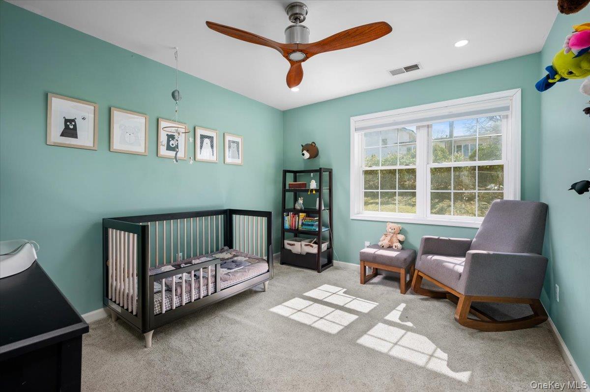 9 Drake Lane White Plains, NY 10607 - Photo 16 of 32 a bedroom with a bed and a couch