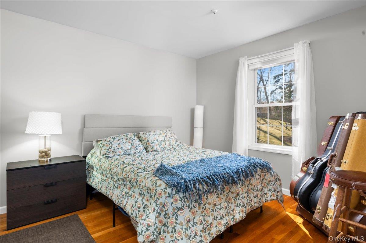 9 Drake Lane White Plains, NY 10607 - Photo 21 of 32 a bed sitting in a bedroom next to a window