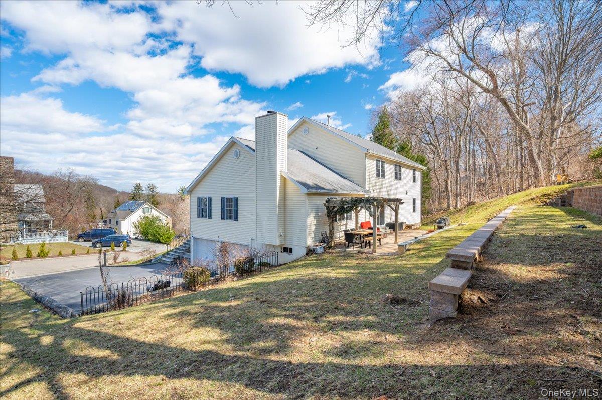 9 Drake Lane White Plains, NY 10607 - Photo 24 of 32 a view of a house with backyard and sitting area