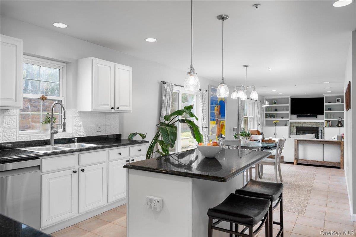 9 Drake Lane White Plains, NY 10607 - Photo 30 of 32 a kitchen with white cabinets and chairs