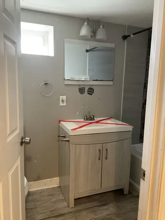 a bathroom with a sink and a mirror