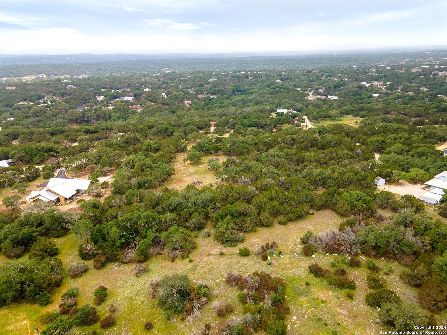 223 Sabella Spring Branch, TX 78070 - Photo 7 of 15 an aerial view of residential houses with yard and mountain view