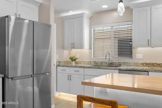 a kitchen with a sink and a stove