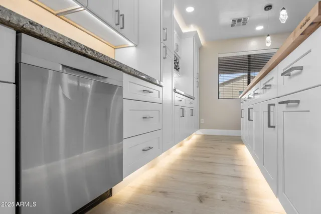 a kitchen with a table and chairs in it