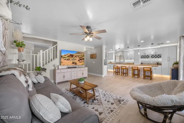 a large kitchen with stainless steel appliances granite countertop a stove and a sink