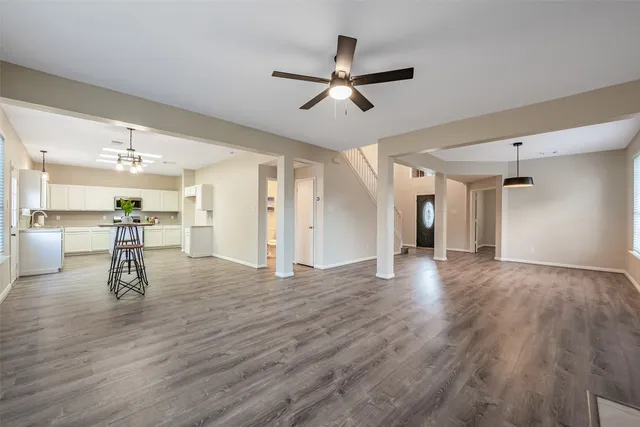 a view of a dining room kitchen and windows