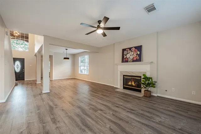 a view of a dining room with furniture wooden floor and chandelier