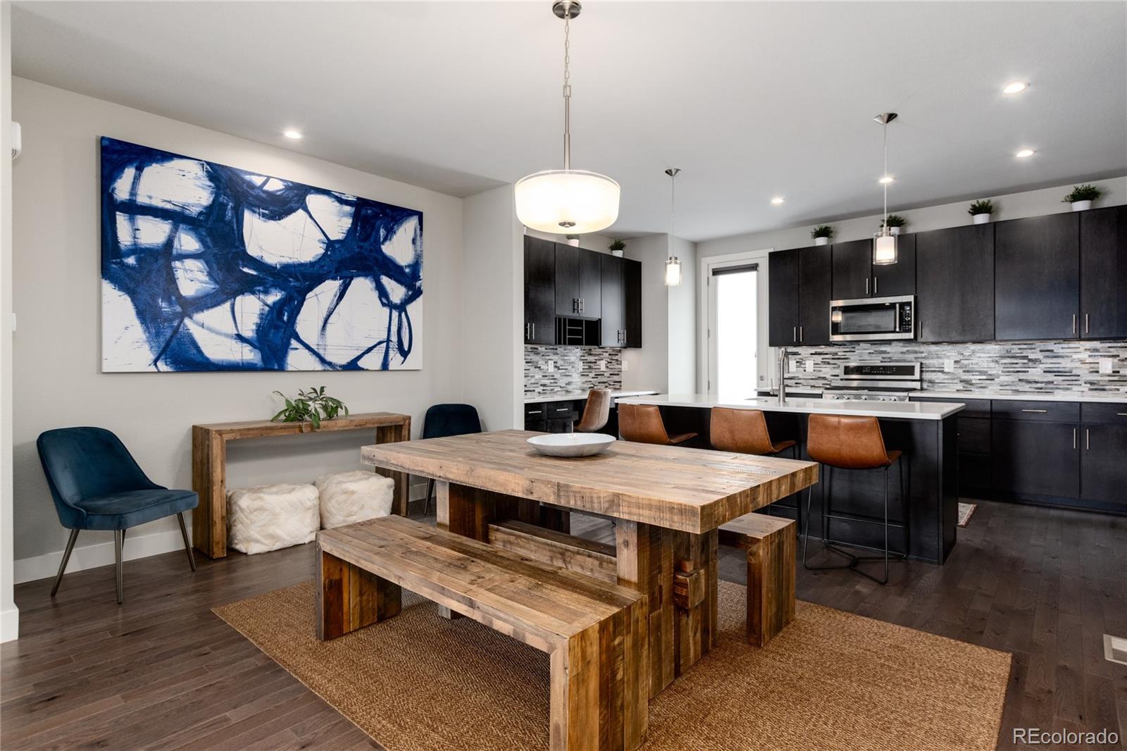2436 North Washington Street Denver, CO 80205 - Photo 11 of 30 a large kitchen with a table and chairs