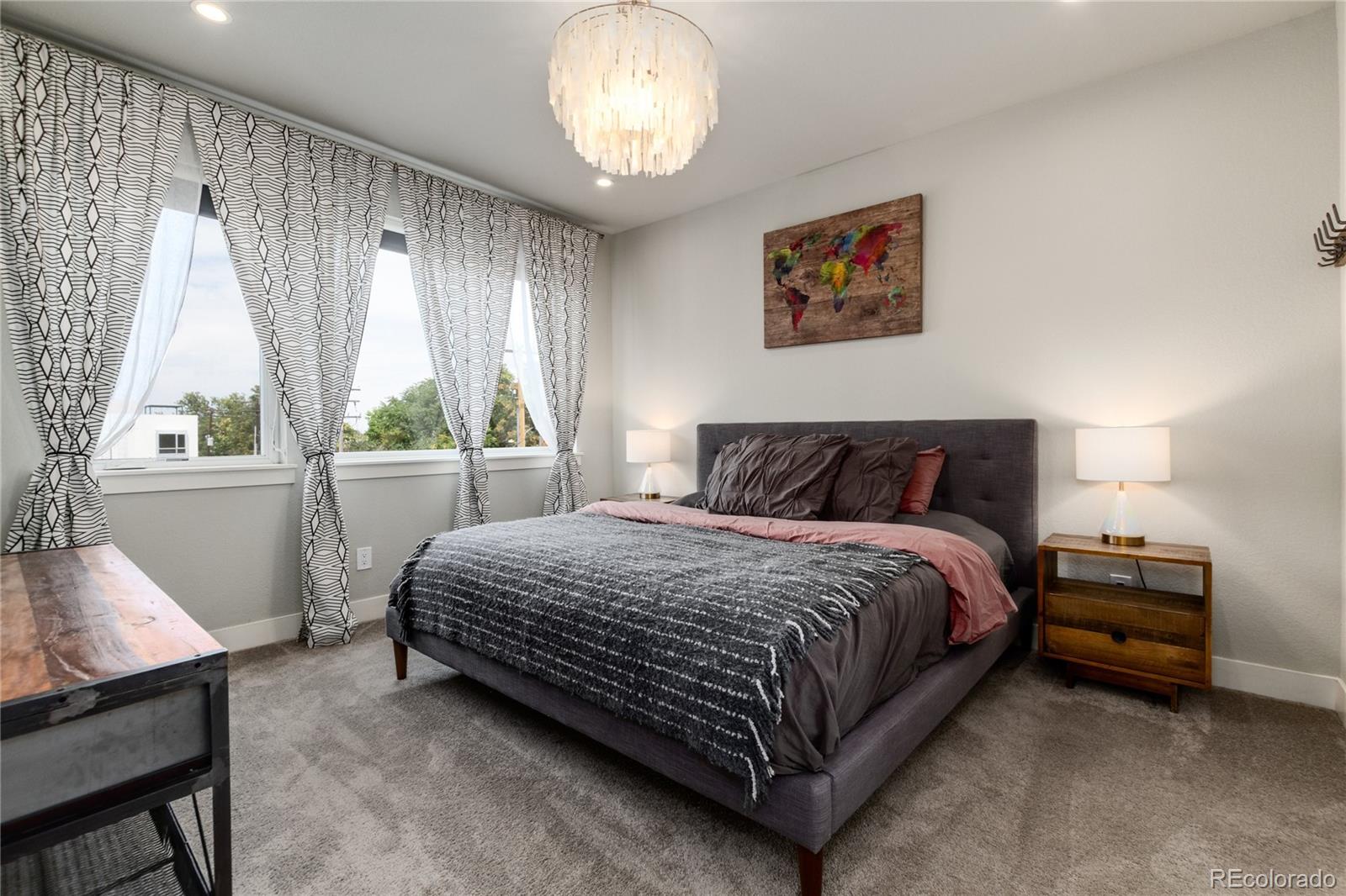 2436 North Washington Street Denver, CO 80205 - Photo 16 of 30 a bedroom with a bed and a window