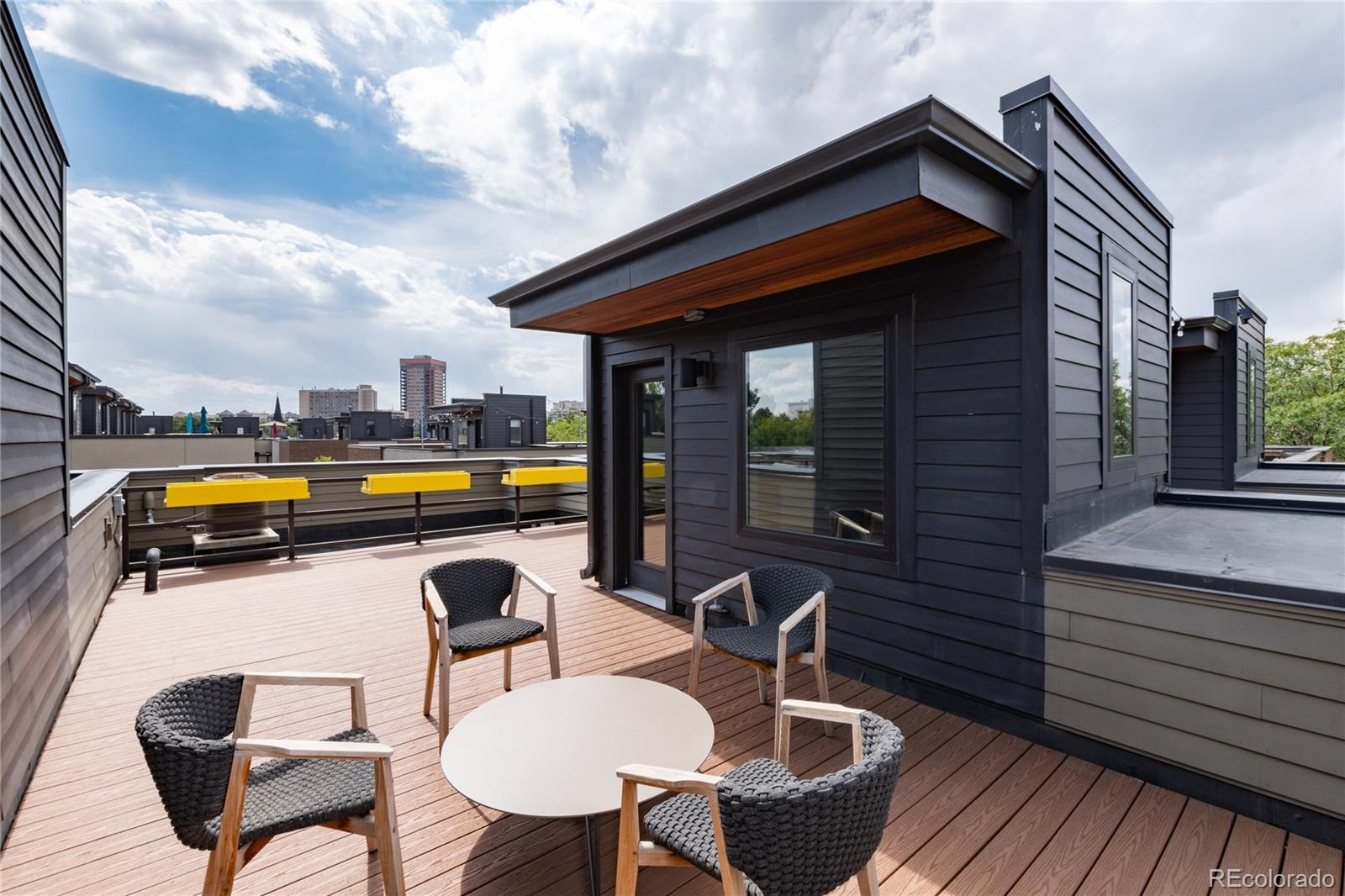 2436 North Washington Street Denver, CO 80205 - Photo 24 of 30 a view of a chair and tables in the balcony