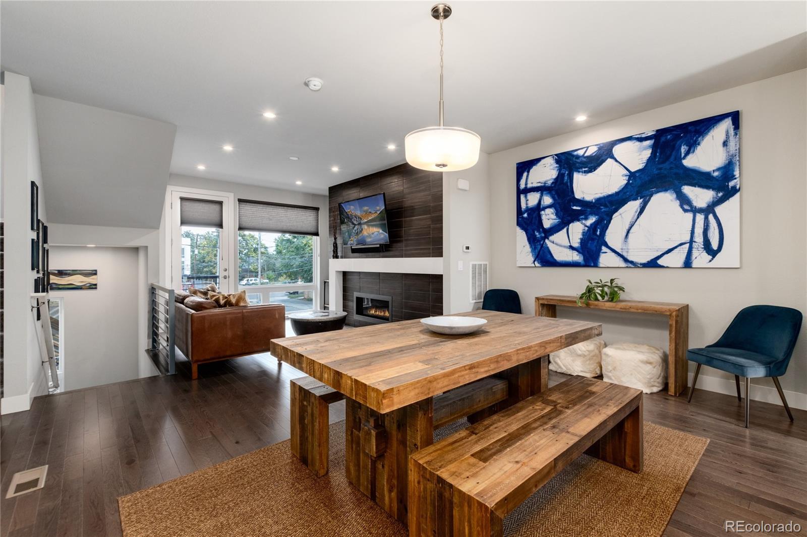 2436 North Washington Street Denver, CO 80205 - Photo 10 of 30 a living room with furniture and a wooden floor