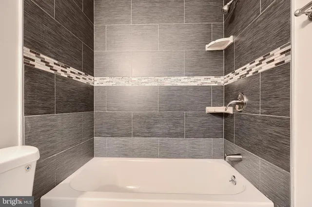 a bathroom with a white bath tub