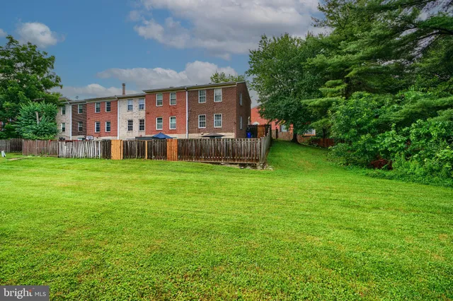 a view of a house with a yard porch and sitting area