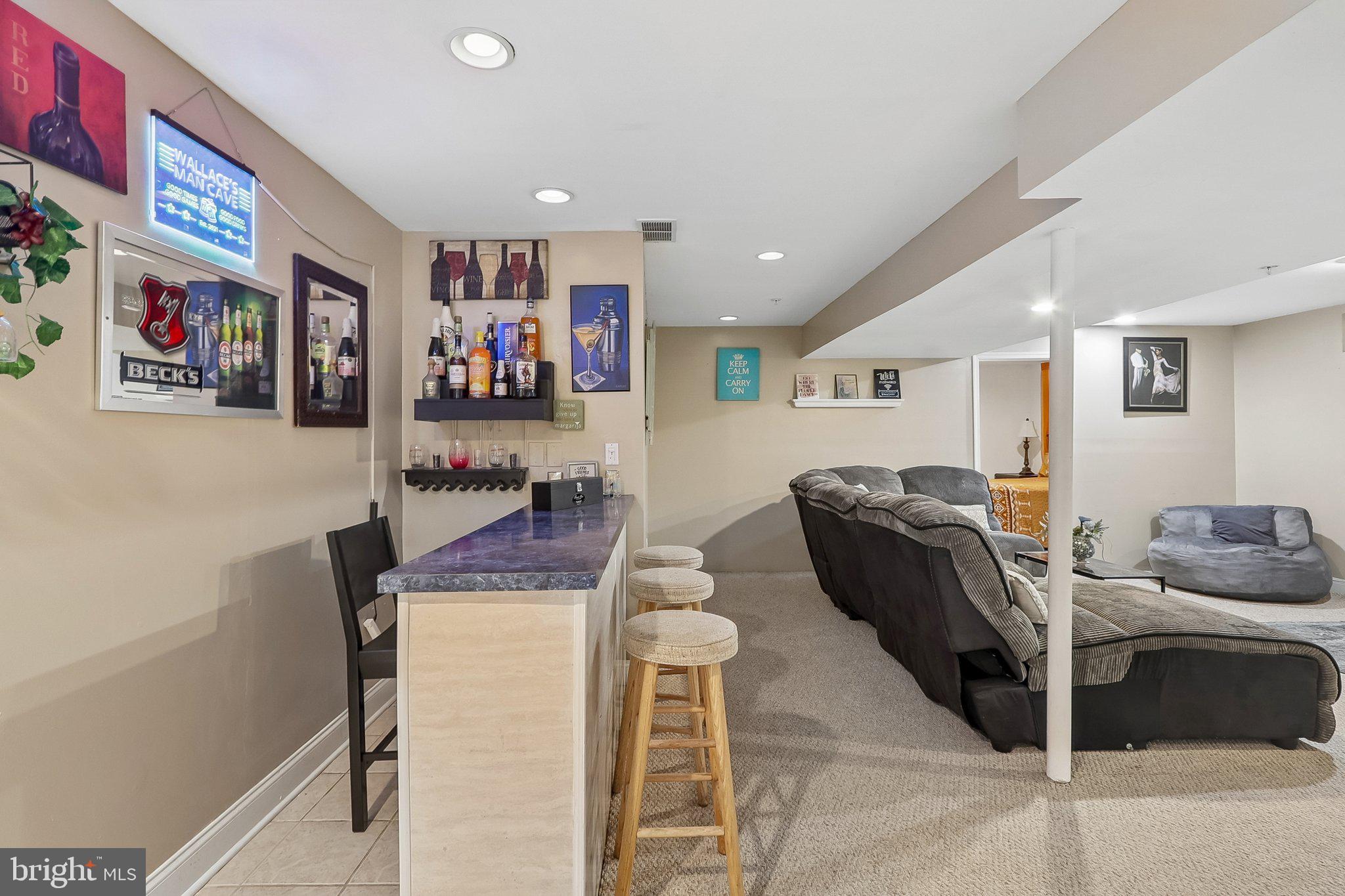 9003 Eldon Drive Clinton, MD 20735 - Photo 39 of 54 Stylish basement bar for entertaining.