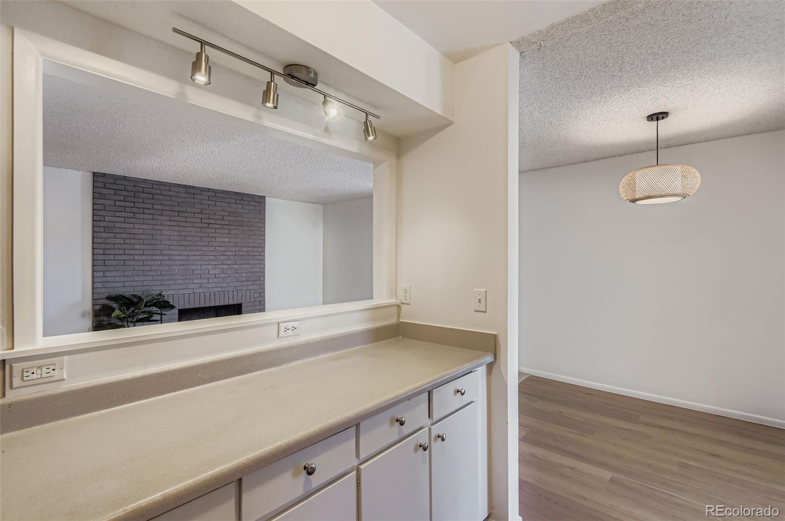 3323 South Monaco Street, Unit D Denver, CO 80222 - Photo 11 of 27 a bathroom with a sink and a mirror
