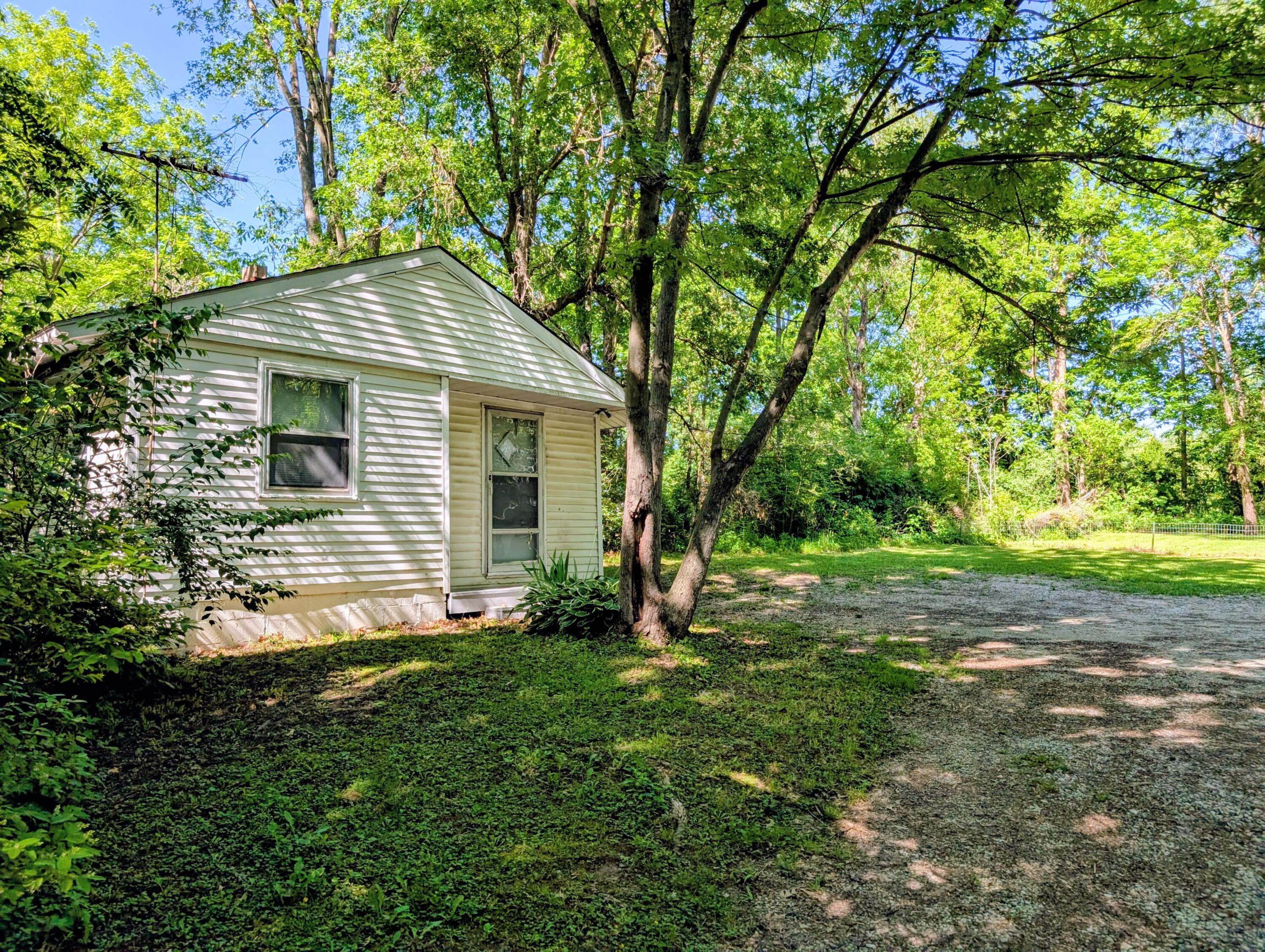 1910 South Calhoun Street Griffith, IN 46319 - Photo 1 of 19 a backyard of a house with lots of green space