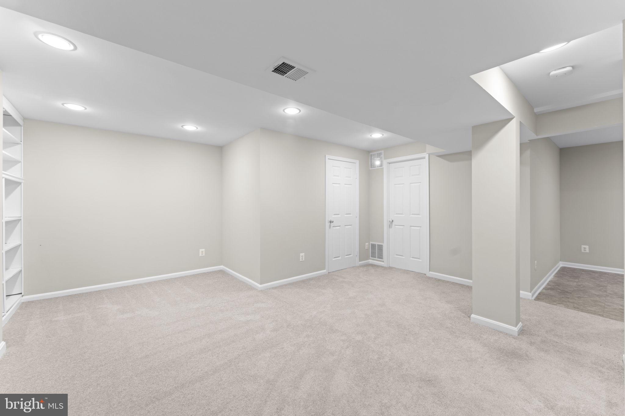 17549 Tedler Circle Round Hill, VA 20141 - Photo 36 of 71 an empty room with windows and entrance to other room