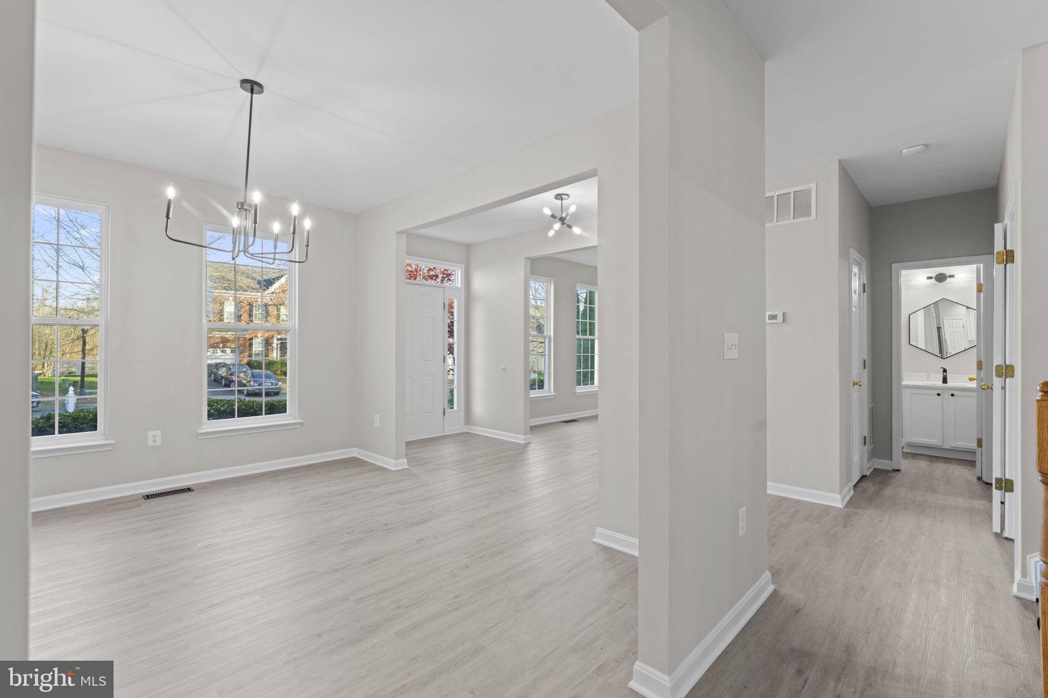 17549 Tedler Circle Round Hill, VA 20141 - Photo 6 of 71 a view of a room with window wooden floor and chandelier