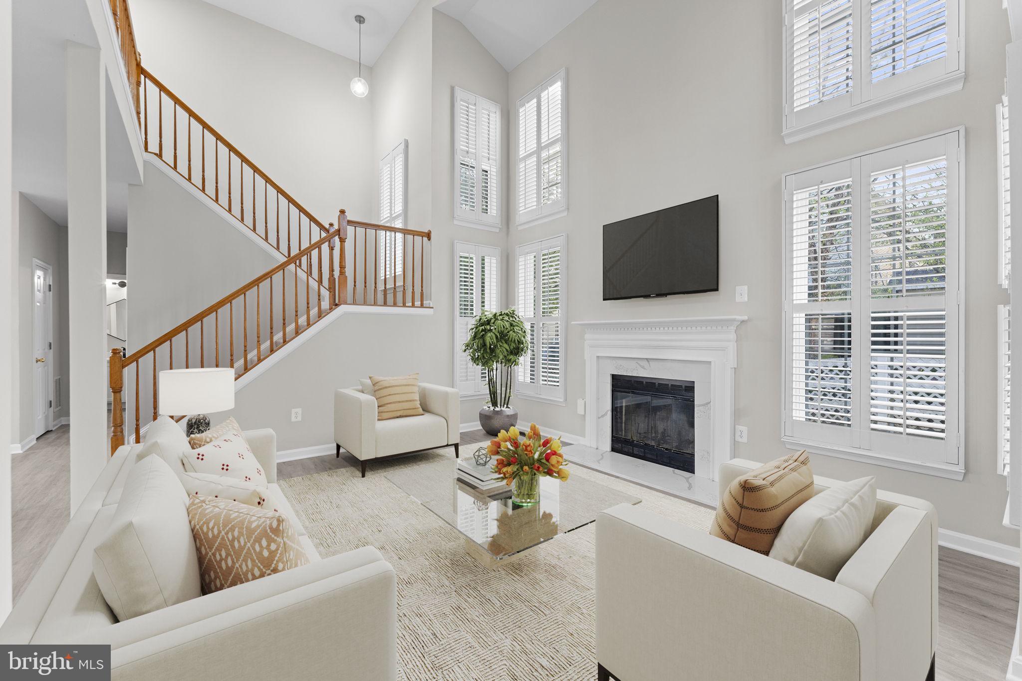 17549 Tedler Circle Round Hill, VA 20141 - Photo 10 of 71 a living room with furniture fireplace and flat screen tv