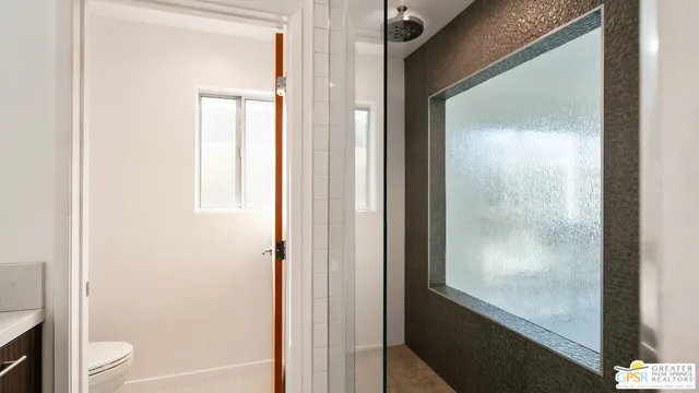 a view of room with window and ceiling fan