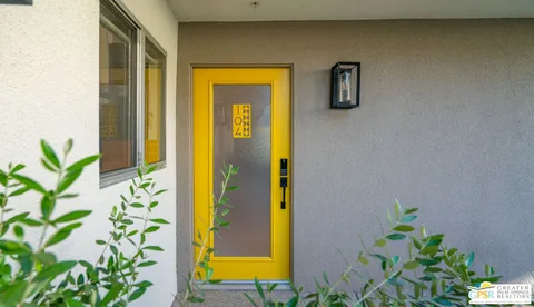 a view of swimming pool with chairs