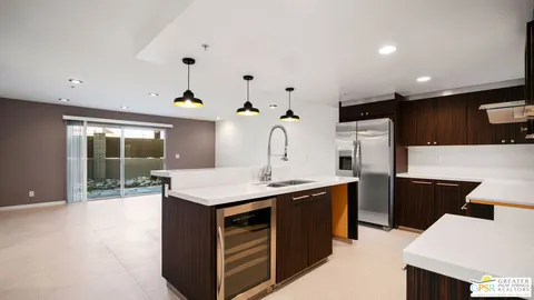 a kitchen that has a sink and a stove in it