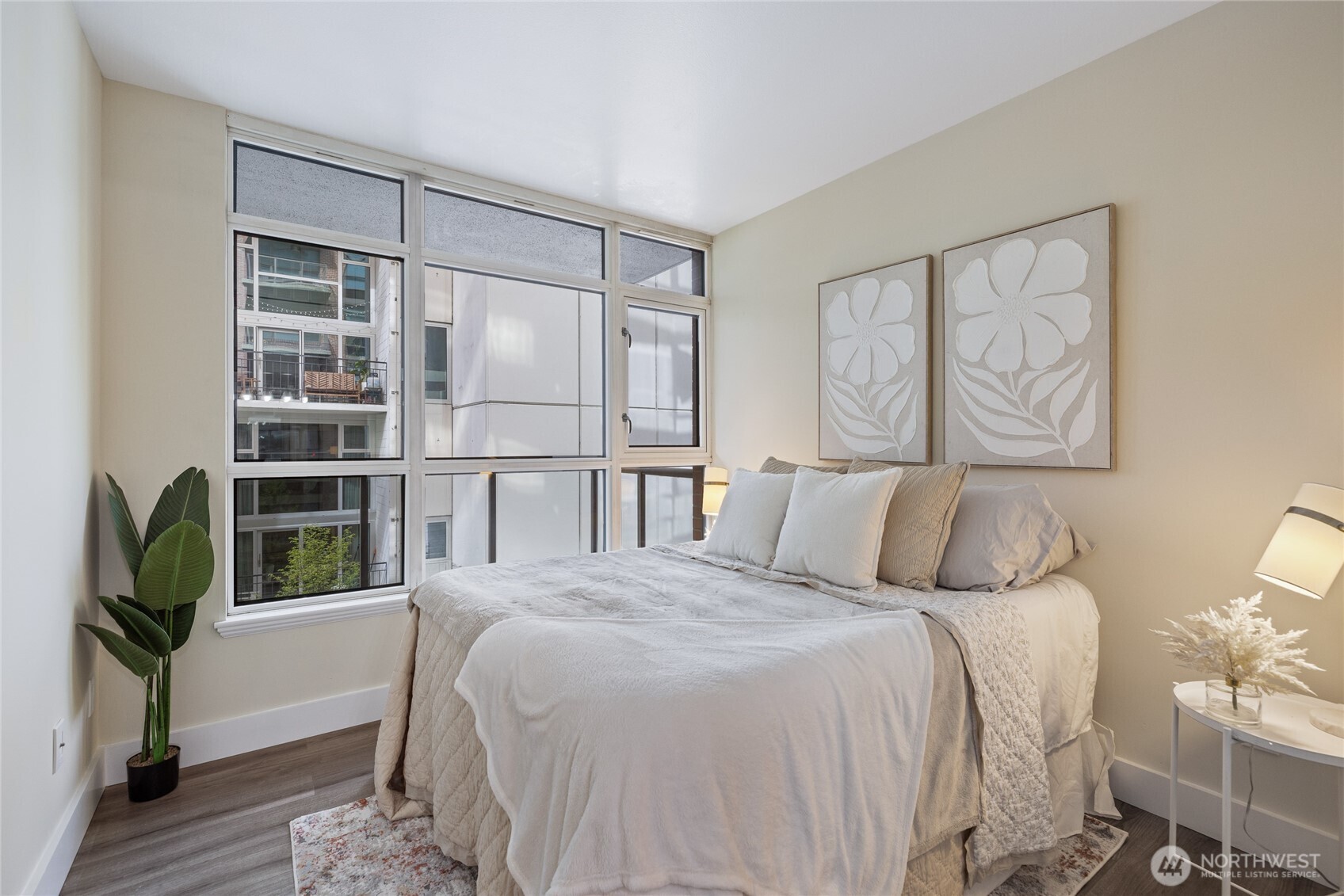 1420 Terry Avenue, Unit 607 Seattle, WA 98101 - Photo 17 of 40 a bedroom with a large bed and a window