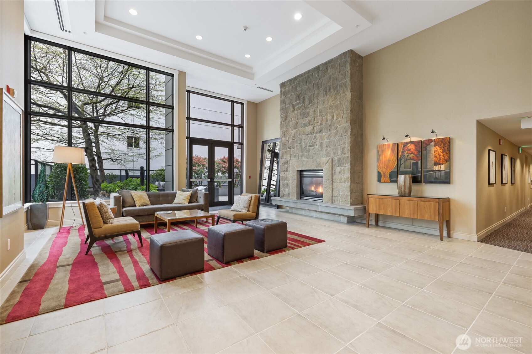 1420 Terry Avenue, Unit 607 Seattle, WA 98101 - Photo 24 of 40 a living room with furniture and large windows