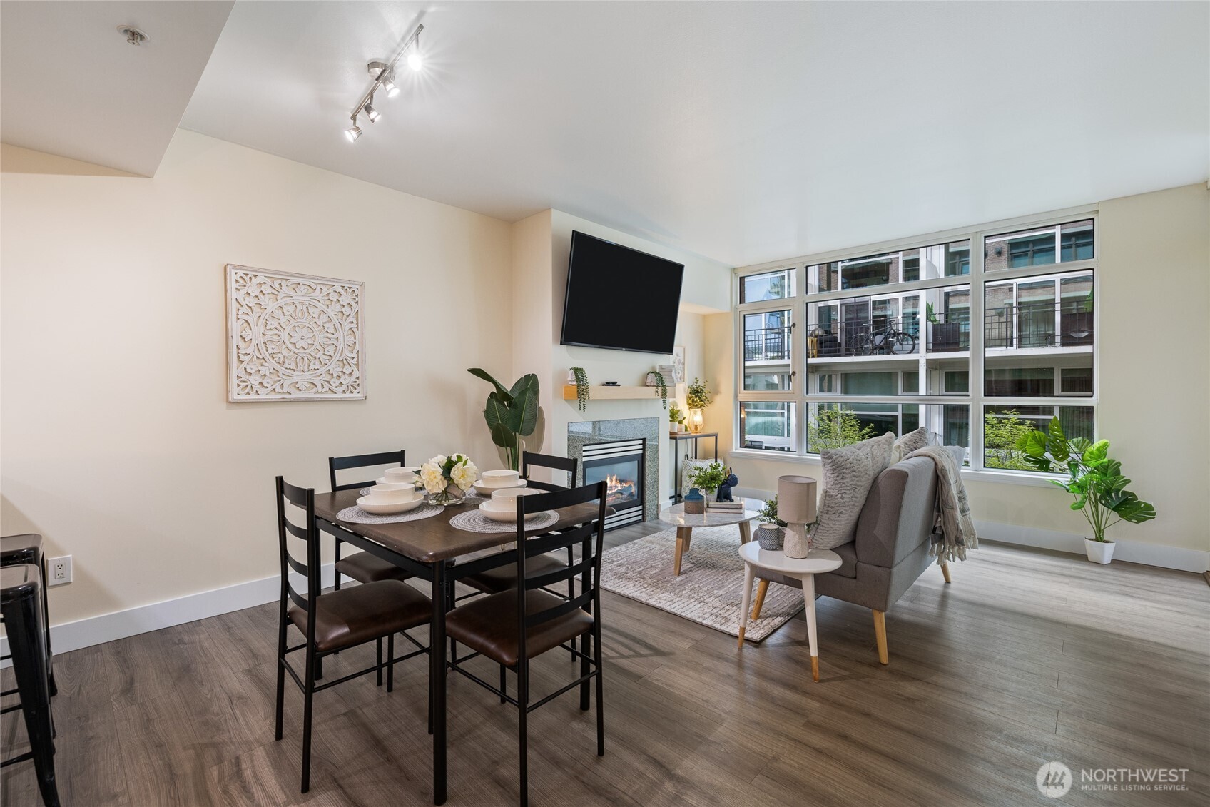 1420 Terry Avenue, Unit 607 Seattle, WA 98101 - Photo 3 of 40 a view of a dining room with furniture window and wooden floor