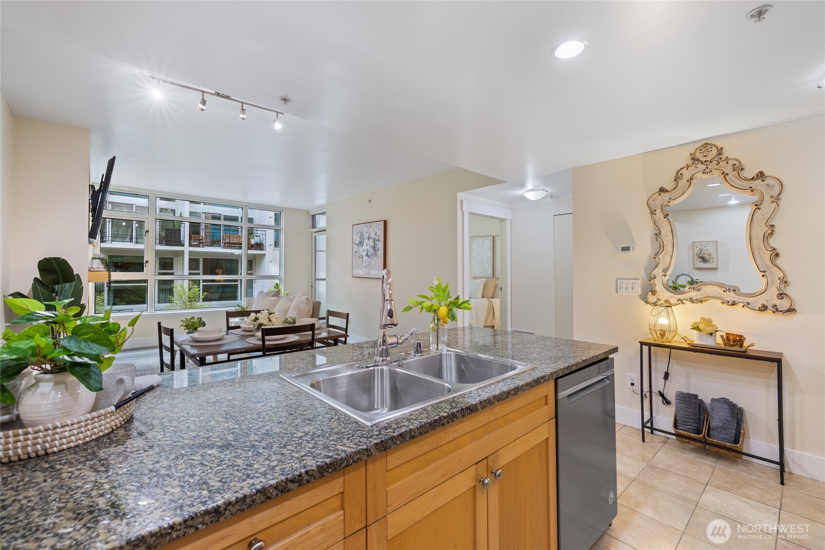 1420 Terry Avenue, Unit 607 Seattle, WA 98101 - Photo 4 of 40 a kitchen with sink refrigerator and window