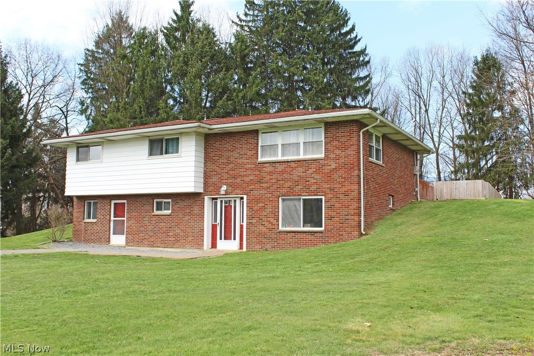 5637 Wylie Ridge Road New Cumberland, WV 26047 - Photo 1 of 21 Back of property featuring a lawn