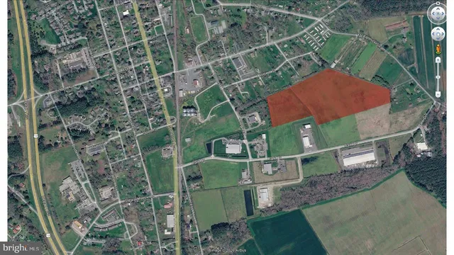 an aerial view of a houses with yard