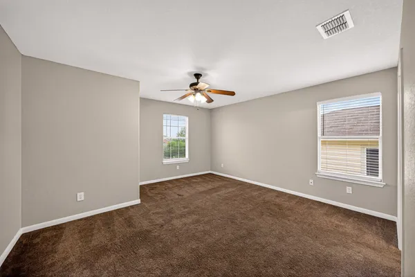 a view of an empty room with a window