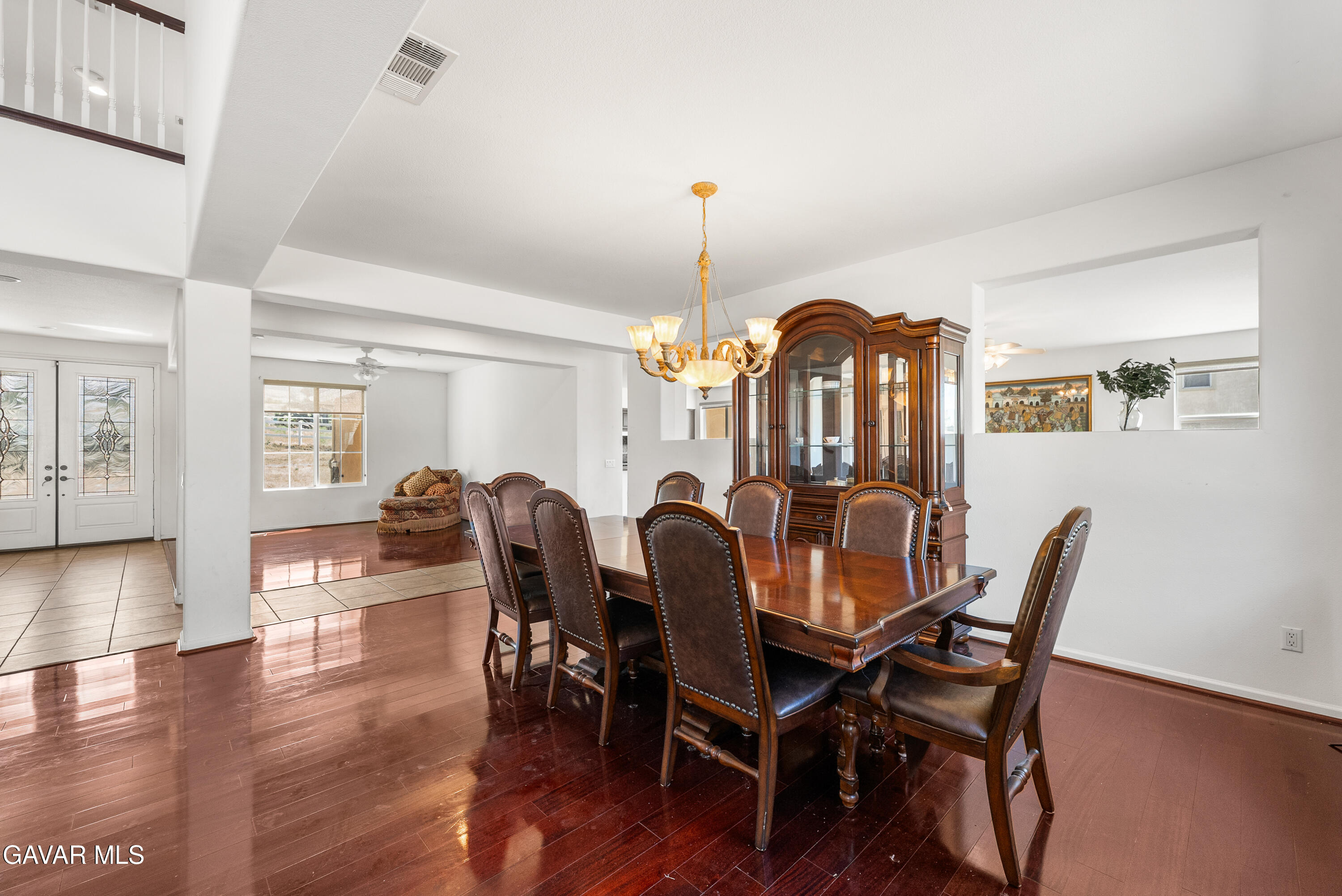 658 Lago Lindo Road Palmdale, CA 93550 - Photo 18 of 91 a view of a dining room with furniture and wooden floor