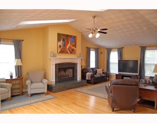69 Olney Keach Road Glocester, RI 02814 - Photo 3 of 12 Den/Family/Great Room. Falling in love will be at first glance & relaxation will always be your first priority in this 24’x24’ cathedral ceiling family room w/skylights, private reading area, zero clearance, wood fireplace, & oversized windows.