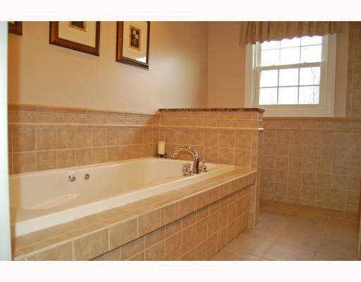 69 Olney Keach Road Glocester, RI 02814 - Photo 10 of 12 Master Bath/Spa. This isnnt a master bath; itts a master bath spa! Complete with his and her sinks, whirlpool jet tub, separate shower and fully tiled! You may be late for work in the morning because you wonnt want to leave!