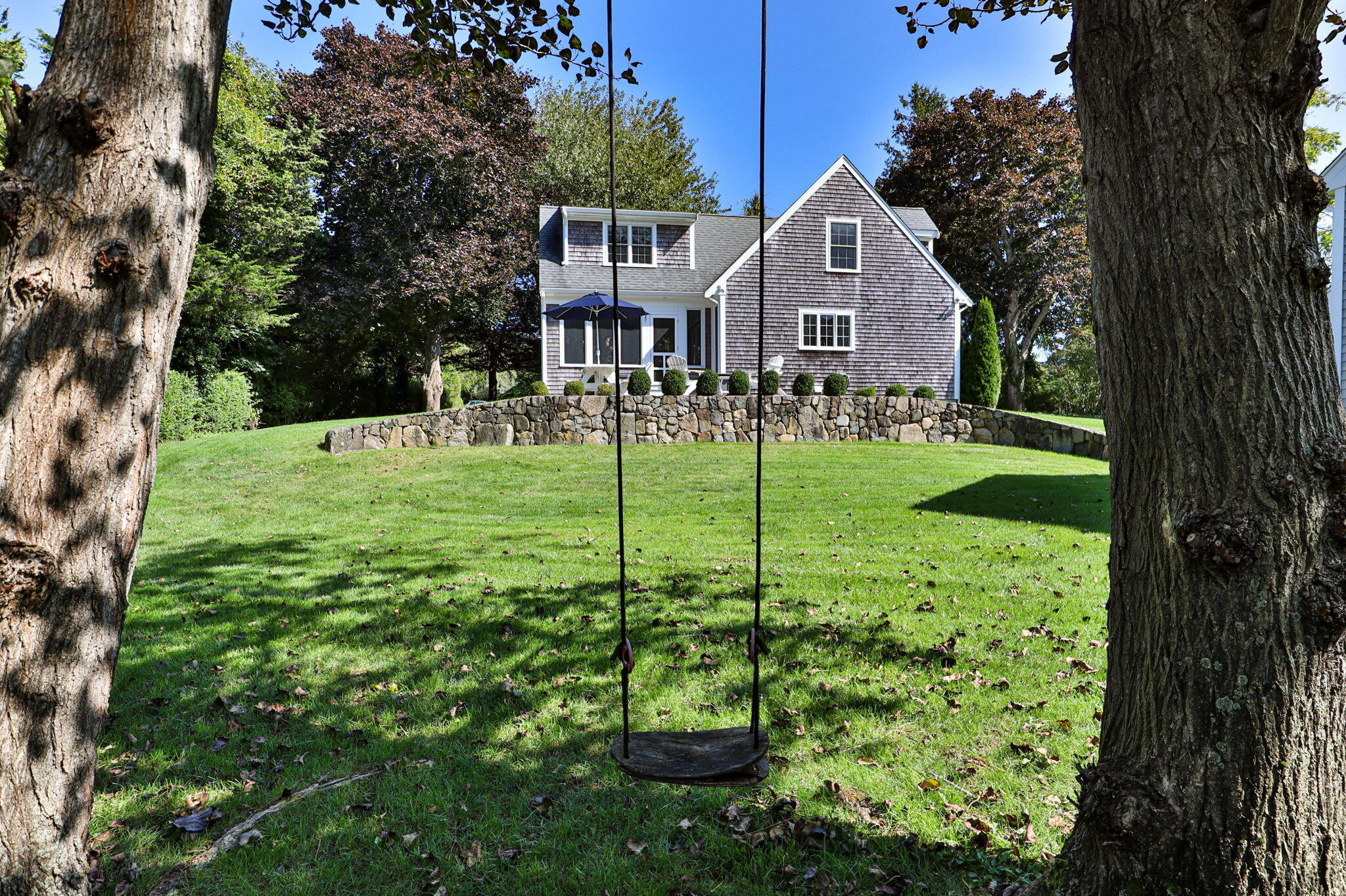96 Pochet Road Orleans, MA 02653 - Photo 49 of 55 a front view of a house with a yard
