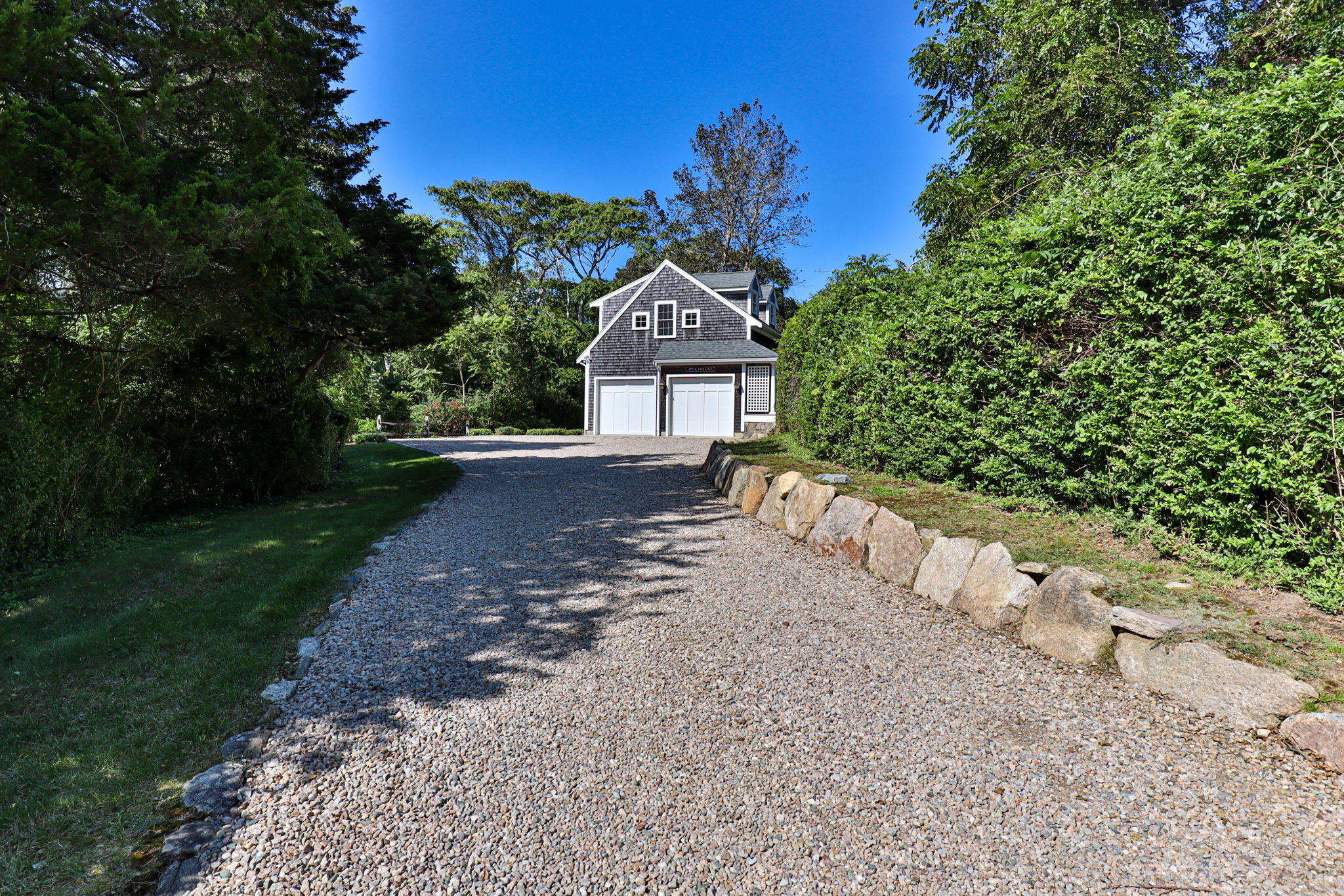 96 Pochet Road Orleans, MA 02653 - Photo 50 of 55 a front view of a house with a yard and pathway