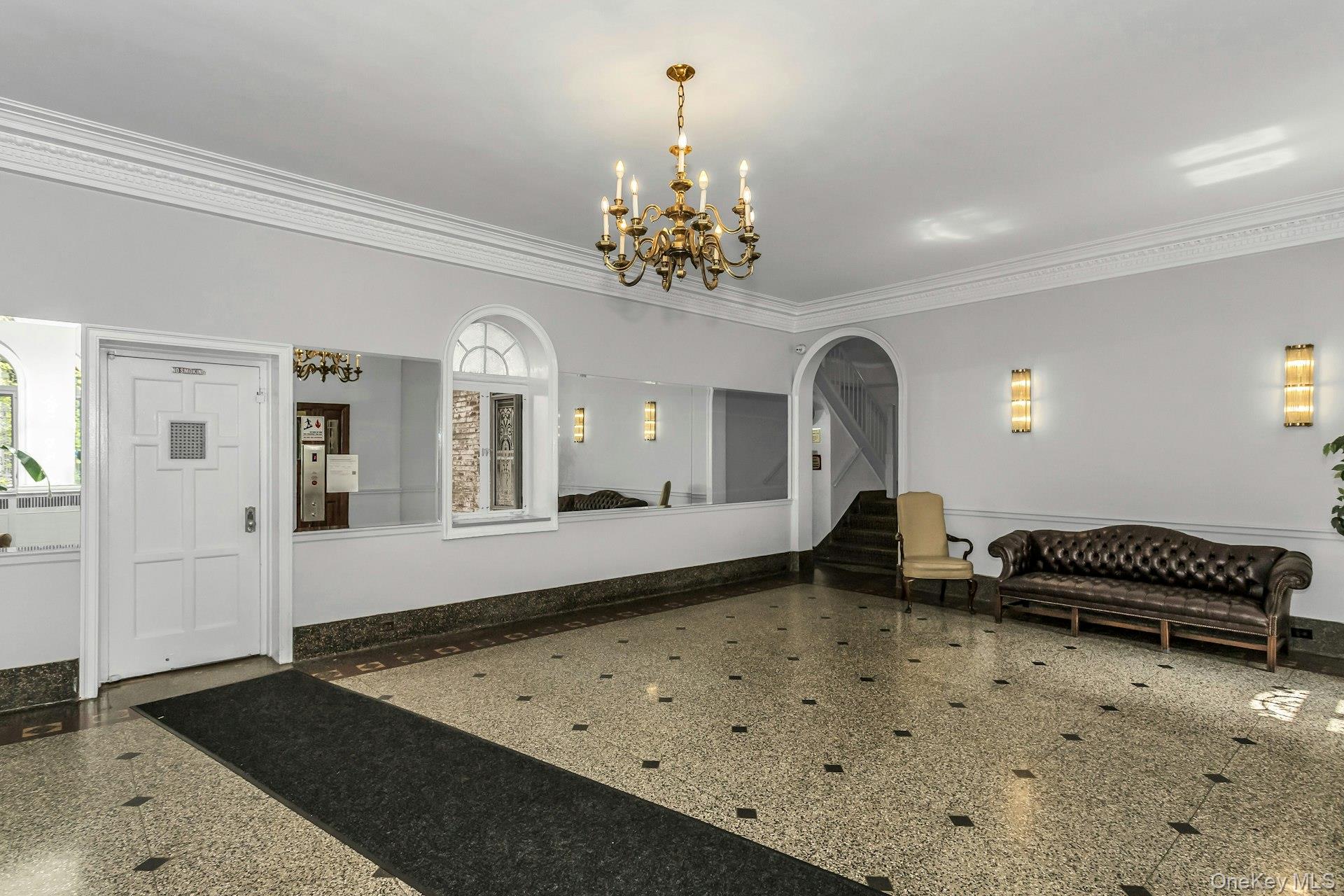 111-39 76th Road, Unit B7 Queens, NY 11375 - Photo 15 of 16 Lobby with ornamental molding and stairway