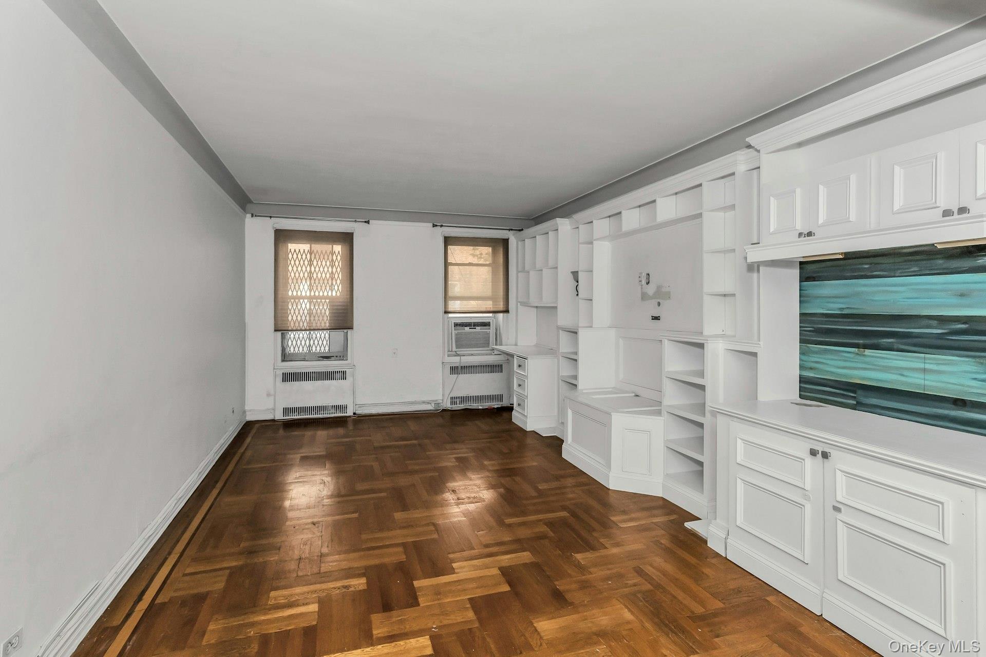 111-39 76th Road, Unit B7 Queens, NY 11375 - Photo 4 of 16 Unfurnished living room with baseboards